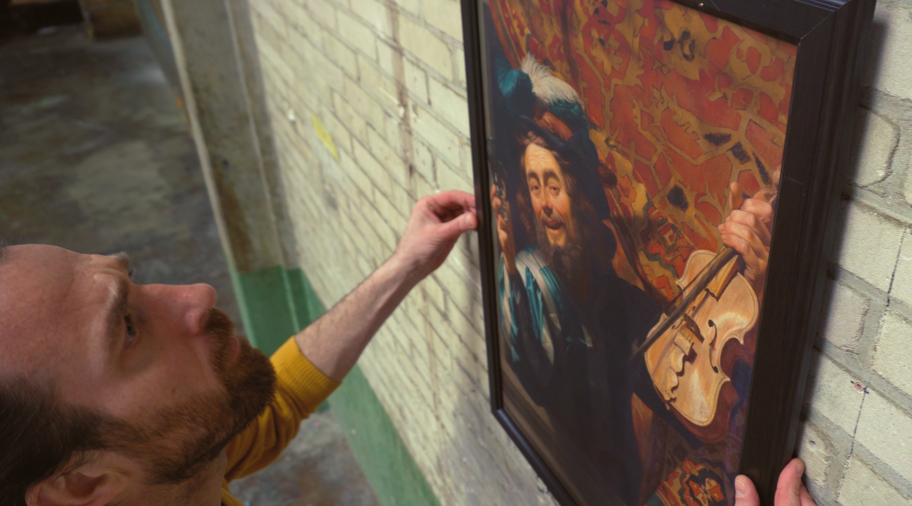 Dirk from MoMoLab hanging the Merry Fiddler for our interactive experience prototype